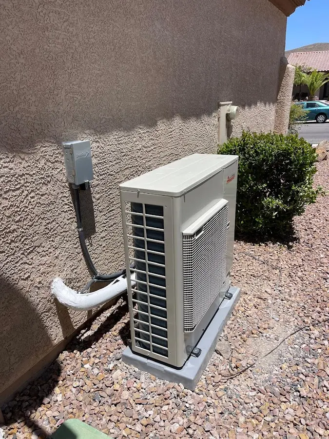 Residential air conditioning condenser unit in Brewster